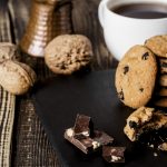 wooden-board-with-cookies-and-coffee-cup
